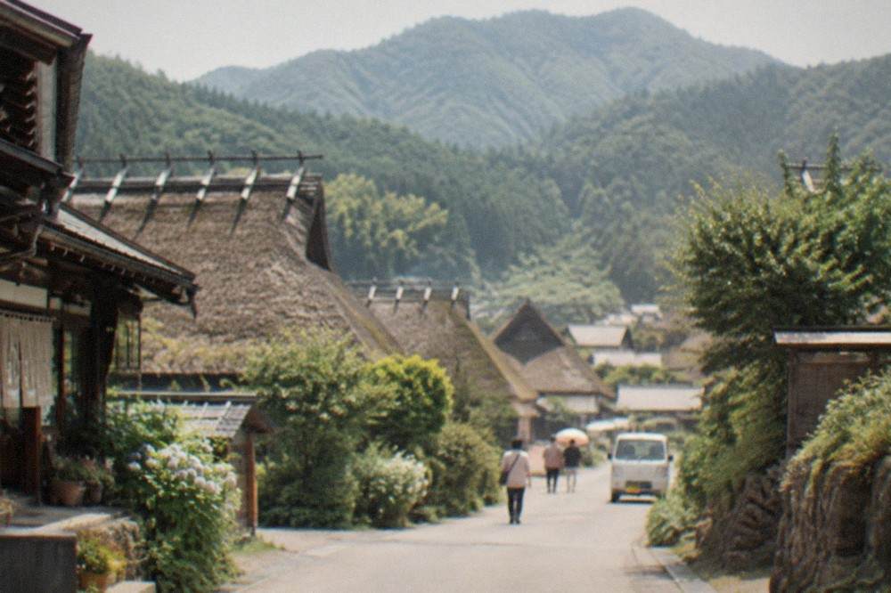 Thatched-roof farmhouses in a mountain basin in Kyoto prefecture under a clear sky