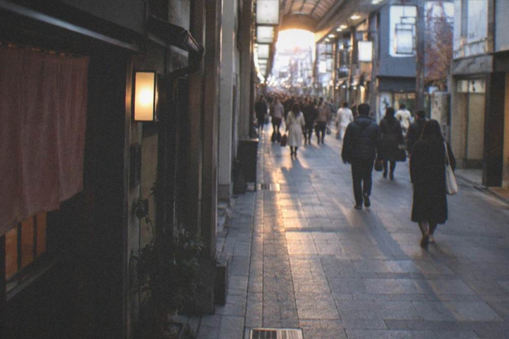 Evening light at the end of a covered shopping arcade in Kyoto