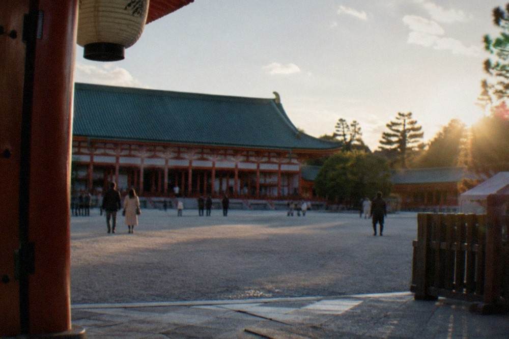 The wide gravel courtyard of Heian Shrine with the green-roofed main hall behind