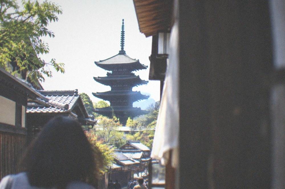 A five-storey pagoda rising above temple roofs in western Kyoto