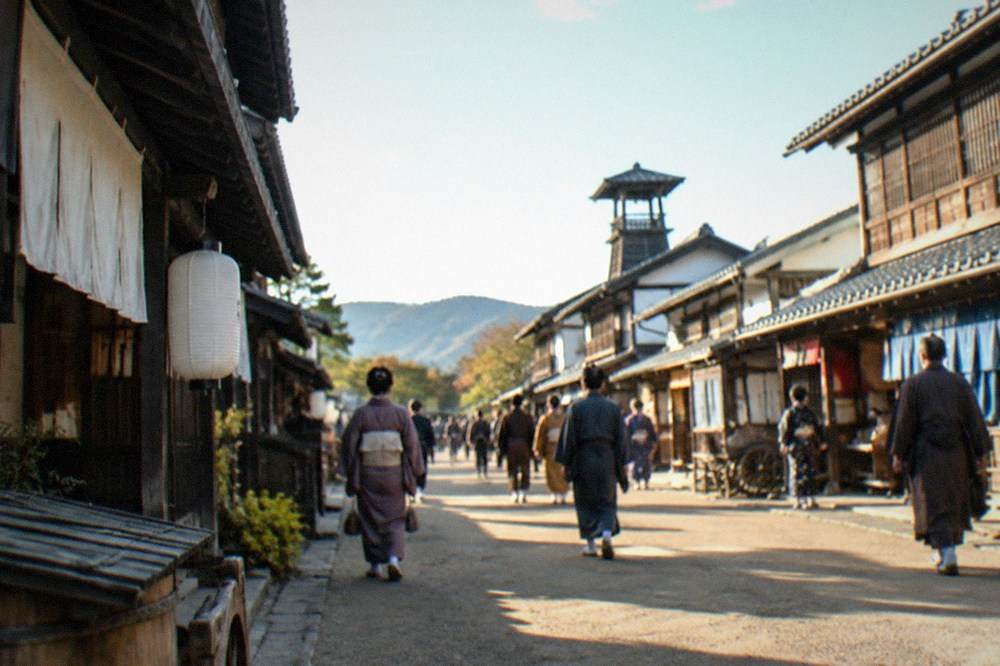 Visitors walking through a recreated samurai town street with extras in period costume