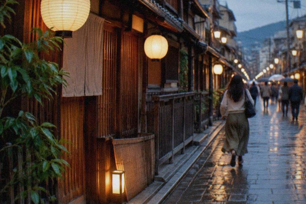 A wooden Kyoto restaurant facade at dusk with paper lanterns glowing over a narrow street