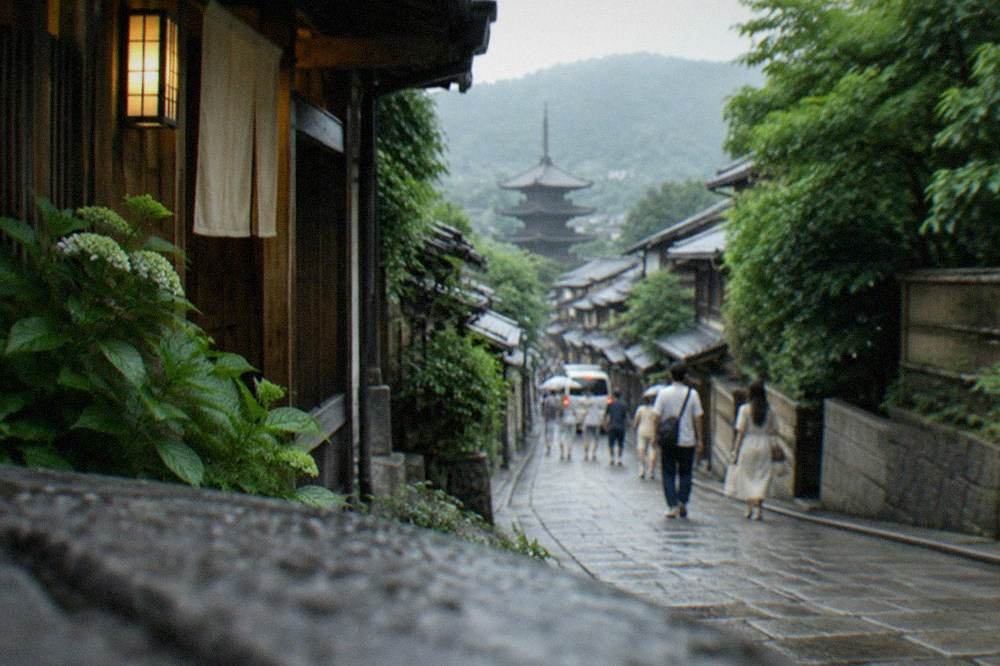 A traditional Kyoto street of wooden machiya townhouses in deep summer greenery