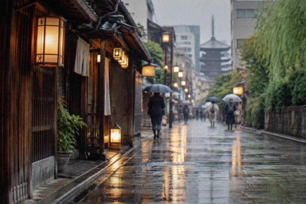 Rain falling on a stone lane in Kyoto with wet lanterns reflecting light